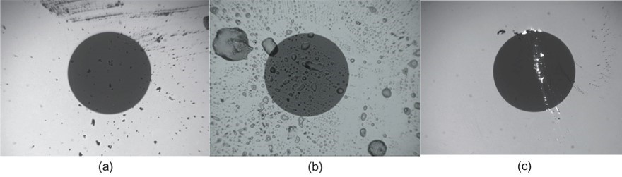 Фотографія торця забрудненого та пошкодженого конектора (a – бруд; b – жир; c – подряпина)